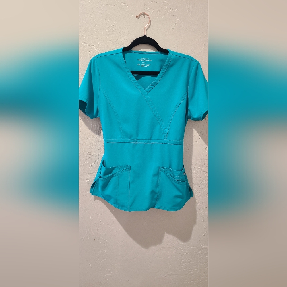Set of 2 scrub tops. Stretch material. Small